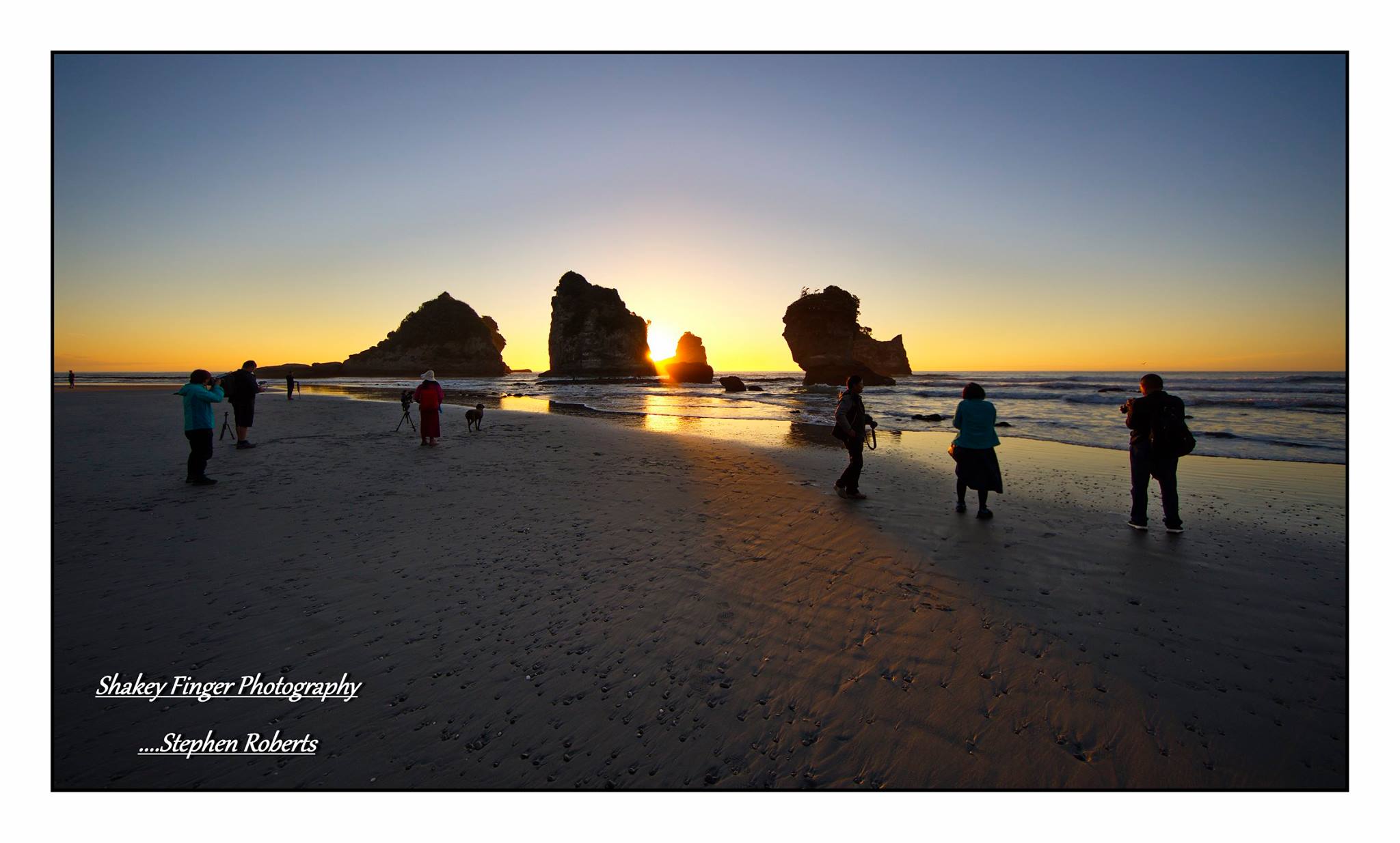 photographers at motukiekie beach on sunset