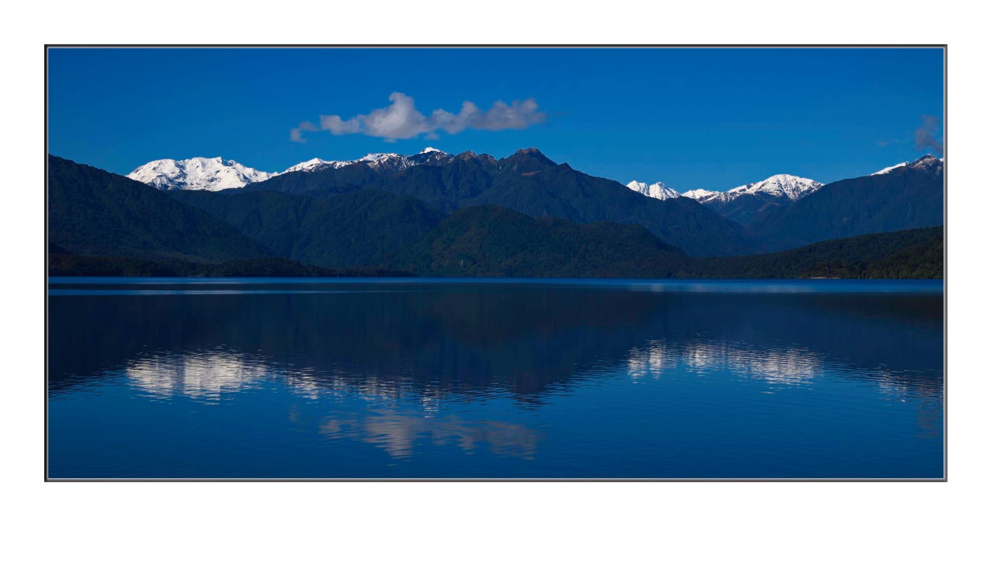 Lake Kaniere West Coast with snow capped Southern Alps